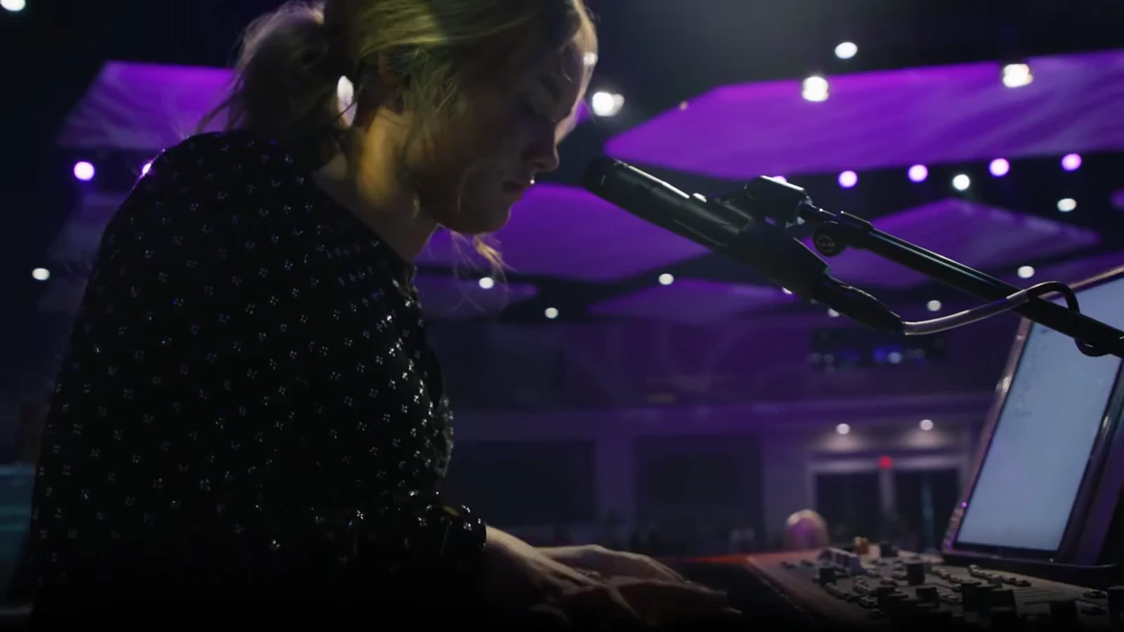 Fallon Erickson playing the keyboard during a church service